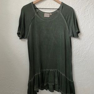 Green top. Loose fit.